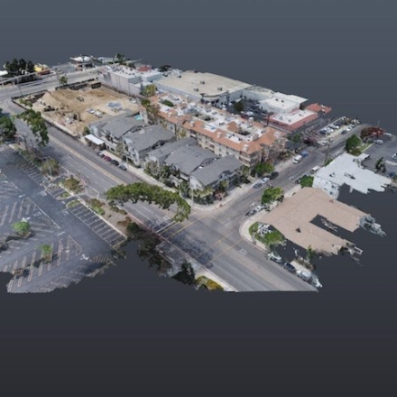 Drone scan of a multi-story building and surrounding streets
